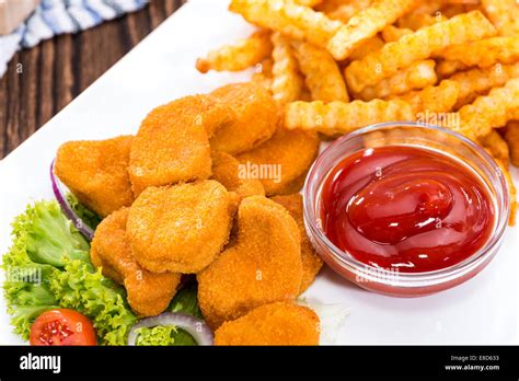 Portion Of Chicken Nuggets With Chips Detailed Close Up Shot Stock