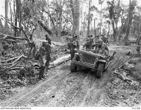 NOEMFOOR ISLAND DUTCH NEW GUINEA C 1944 07 US AND RAAF TROOPS WALK