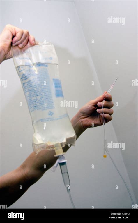 A Home Care Nurse Prepares An Intravenous Injection Of Lactated Ringer