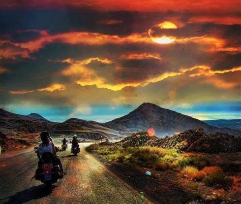 Couple On Motorcycle Sunset