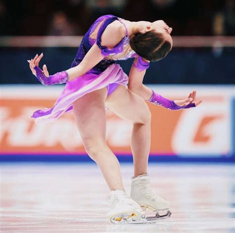 A Female Figure Skating On An Ice Rink