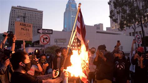 Demonstrators Burn Flag In Downtown Los Angeles To Protest Death Of