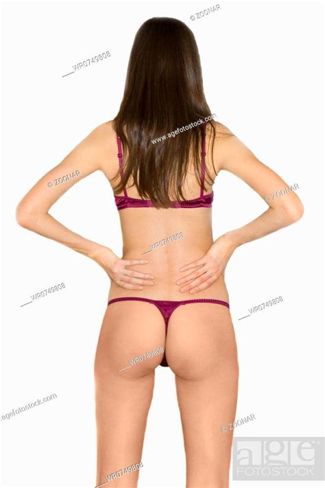 Rear View Of A Perfect Brunette Woman In Bikini Hi Key Studio Shot