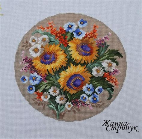 A Cross Stitch Pattern With Sunflowers And Pansies In A Circle On A