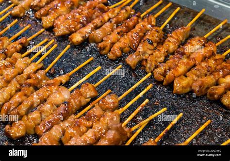 Tasty Chicken Satay Sticks On The Grill Stock Photo Alamy