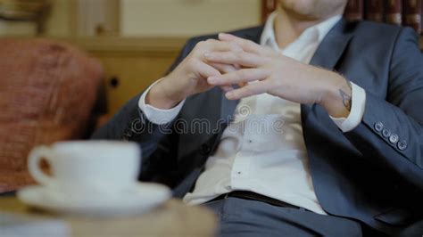 Two Men In Suits Sit In A Restaurant A Business Meeting Men Drink