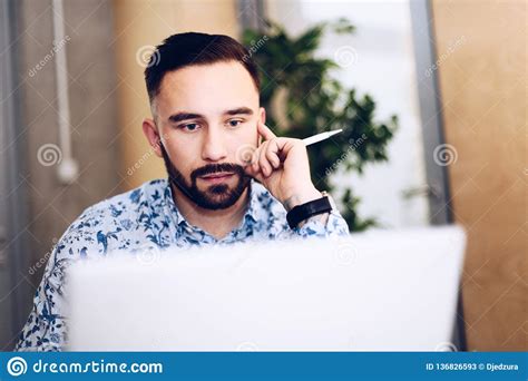 Caucasian Concentrated Businessman Working On Laptop Computer In His