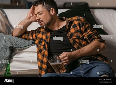 Mature Man Drinking Beer At Home Concept Of Alcoholism Stock Photo Alamy