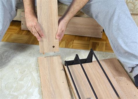 Premium Photo Man Assembling Parts Of A New Shoe Rack Drawer