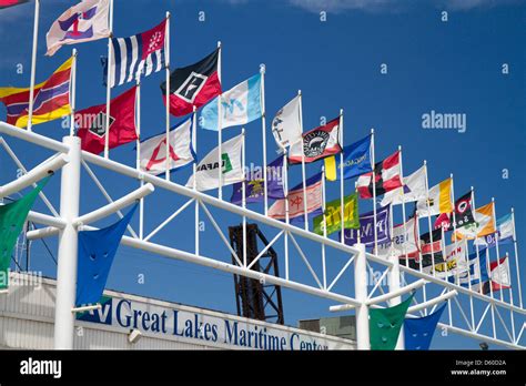 Shipping Company Flags In Front Of The Great Lakes Maritime Center