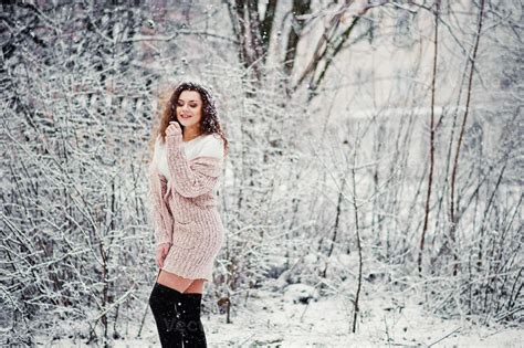 Curly Brunette Girl Background Falling Snow Wear On Warm Knitted Sweater Black Mini Skirt And