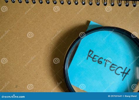 Concept Of Regtech Write On Sticky Notes Isolated On Wooden Table Stock