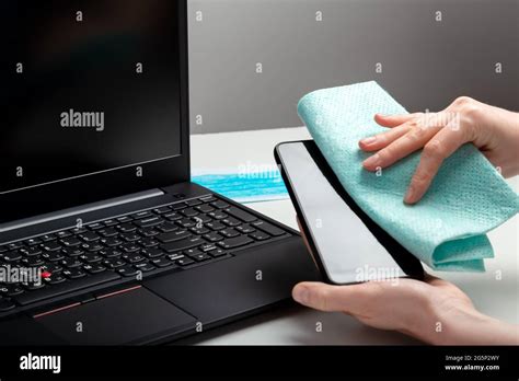 Disinfection Phomeand Laptop Keyboard By Alcohol Disinfectant Woman