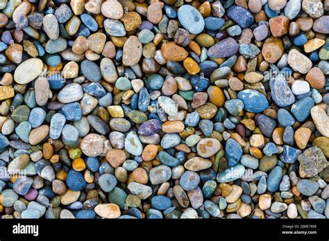 These Are Wet River Pebbles And Small Round Pebbles Solid Background