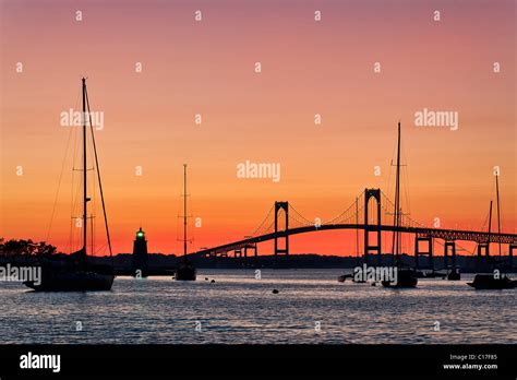 Goat Island Lighthouse And The Jamestown Or Pell Bridge At Sunset