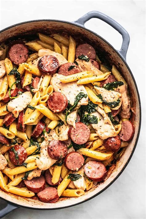 Easiest Chicken And Sausage Pasta With Spinach In A Light Cream Sauce This 30 Minute Meal Is