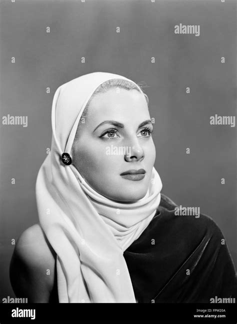 S S Portrait Blonde Woman Wearing White Head Scarf Cowl Hood