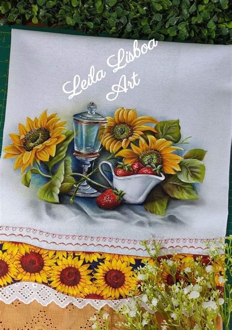 There Is A Banner With Sunflowers And A Teapot On The Table Next To Flowers