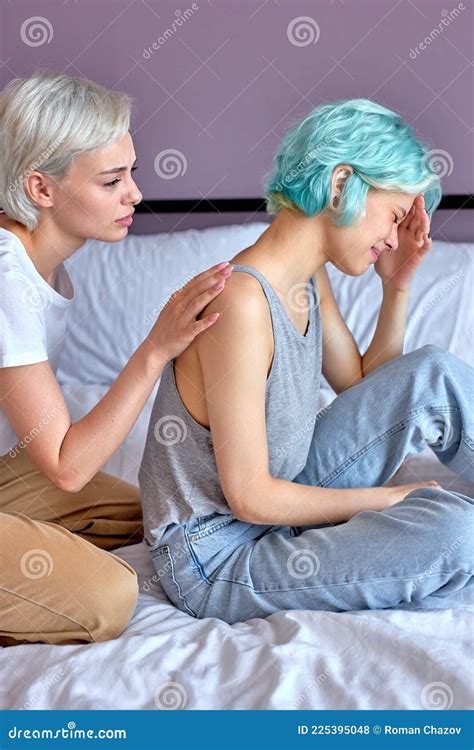 Upset Lesbian Not Talking To Girlfriend After Having Quarrel On Bed At Home Stock Photo Image