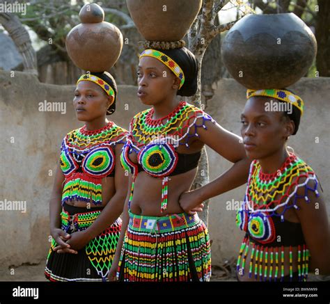 Zulu Girls Wearing Traditional Beaded Dress and Carrying Pots on Stock Photo: 33035669 - Alamy