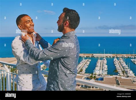 A Gay Couple On A Sunny Summer Day With The Sea Behind Them Stock Photo Alamy