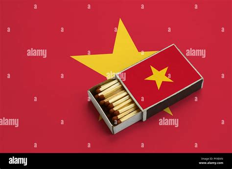 Vietnam Flag Is Shown In An Open Matchbox Which Is Filled With Matches