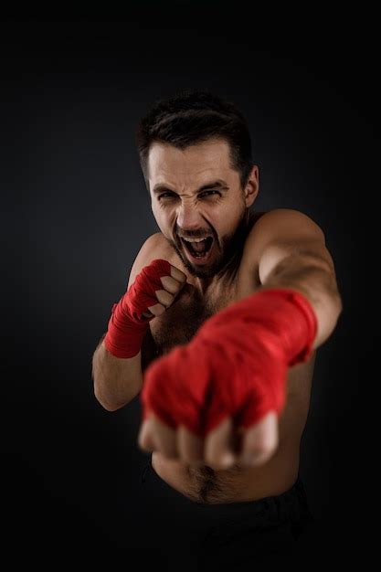 Premium Photo Boxer Throwing A Fierce And Powerful Punch