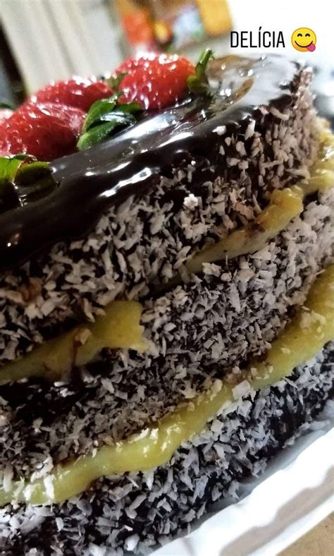 A Layered Cake With Chocolate And Strawberries On Top