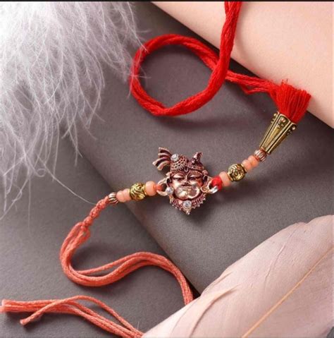 Fancy Rakhis Red Brass Shreenathji And Beads Rakhi At Rs 159 Piece In