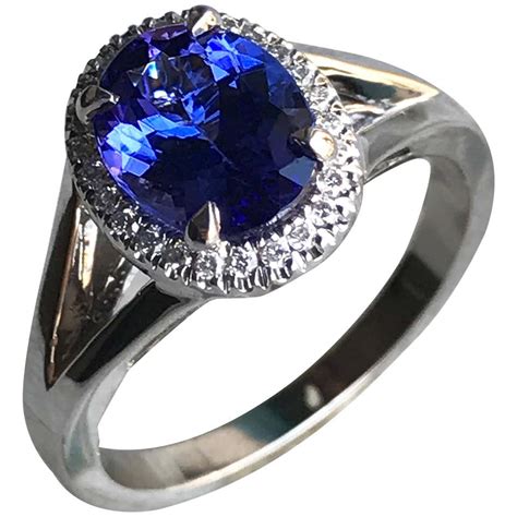 Oval Violet Tanzanite With Diamond Engagement Halo Ring 18 Karat White