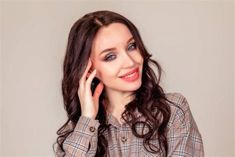 520 Portrait Of Smiling Business Woman With Folded Hands Isolated On