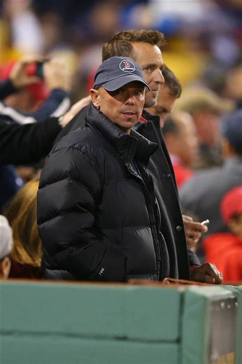 Man In Black Jacket At Baseball Game