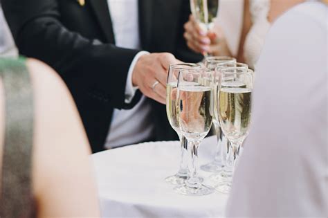 Waiter Serving Tray With Champagne Glasses For Guests At Wedding Reception Outdoors Luxury Life