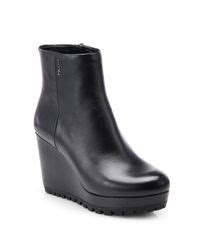 Prada Leather Wedge Ankle Boots in Black | Lyst