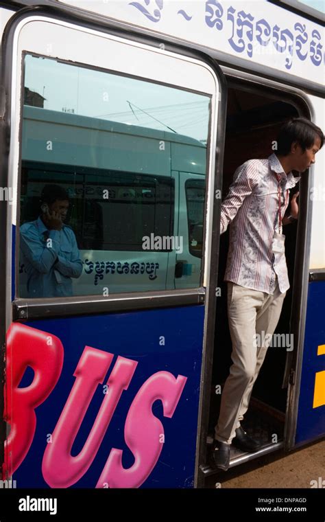 A Colorful Bus Prepares To Transport Passengers From Phnom Penh To Ho