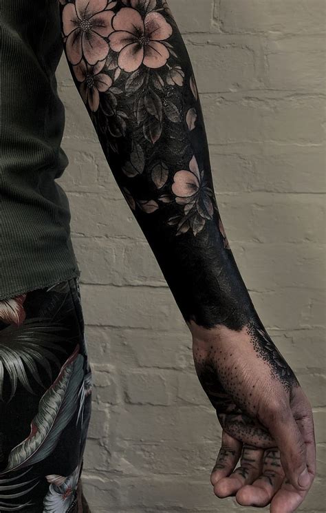 These Striking Solid Black Tattoos Will Make You Want To Go All In