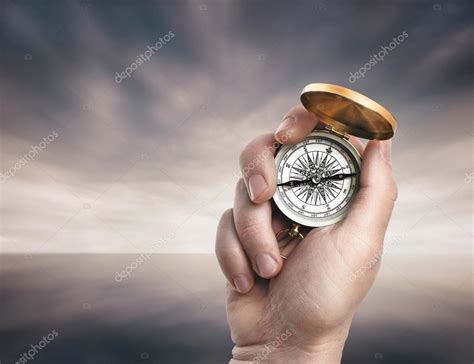 Hand Holding Compass Stock Photo By Olegkrugllyak 83546354