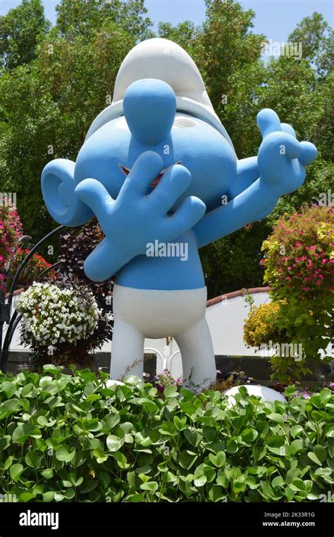 Dubai UAE June 01 2022 A Giant Figure Of A Smurf Holding Up Two