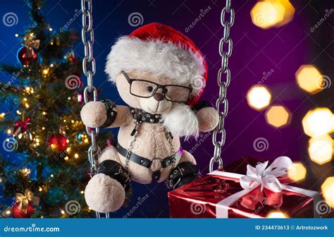 A Teddy Bear In A Santa Claus Hat Is A Christmas T For Bdsm Games On