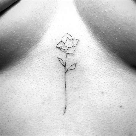 Fine Line Rose Tattoo Located On The Sternum