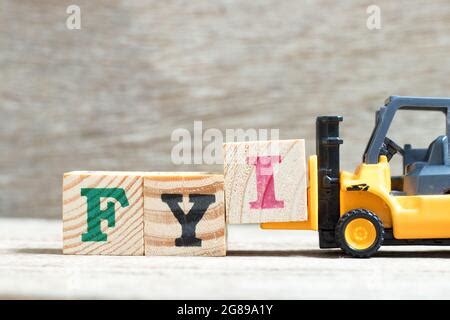 Toy Forklift Hold Letter Block O To Complete Word Iso On Wood