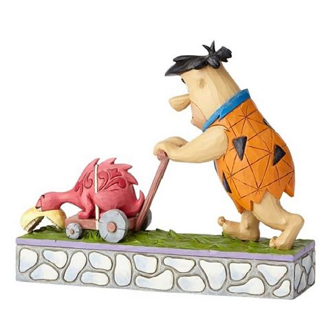 A Figurine Of A Man Pushing A Dragon On A Cart