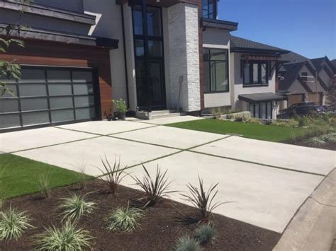 Concrete Driveway With Grass Strips In Abbotsford Bc