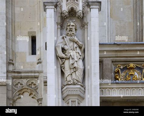 London, England, UK. Westminster Abbey - statue above main entrance. St Edward the Confessor ...