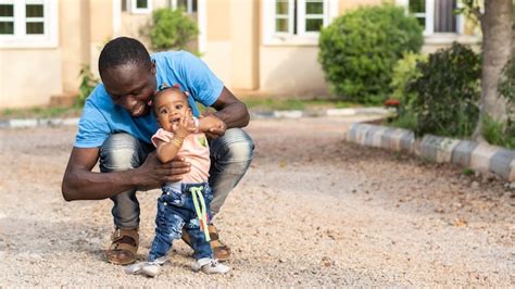 Free Photo Father Holding Kid Medium Shot