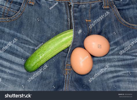 Penis Cucumber And Eggs On Jeans Background Stock Photo