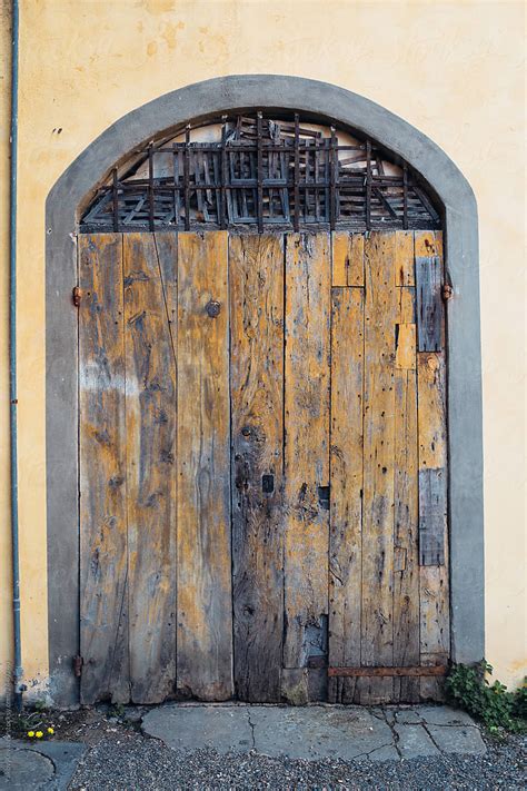 Traditional Old Wooden Door In Italian House By Stocksy Contributor Yakov Knyazev Stocksy