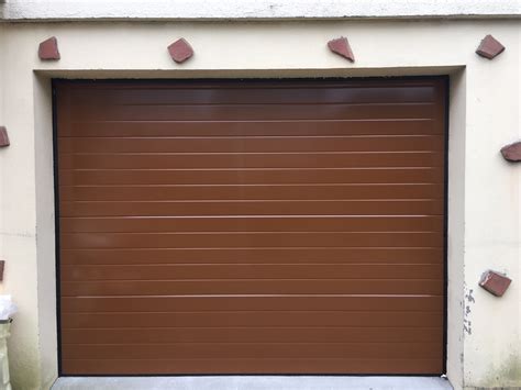 Installation porte de garage sectionnelle motorisée Cent Pour Cent Pose