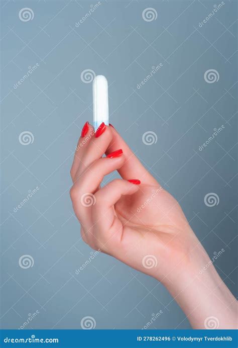 Hand Holding Menstruation Tampon Womens Menstrual Cramps Menstruation Feminine Tampon Stock