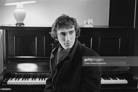 English Actor Phil Daniels Posed Beside A Piano On Location During